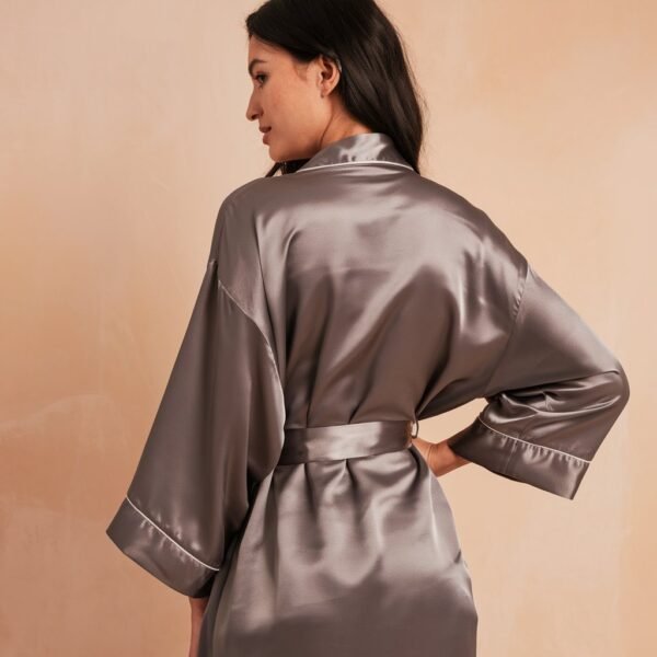 a-product-photograph-of-a-woman-wearing-a-solid satin robe